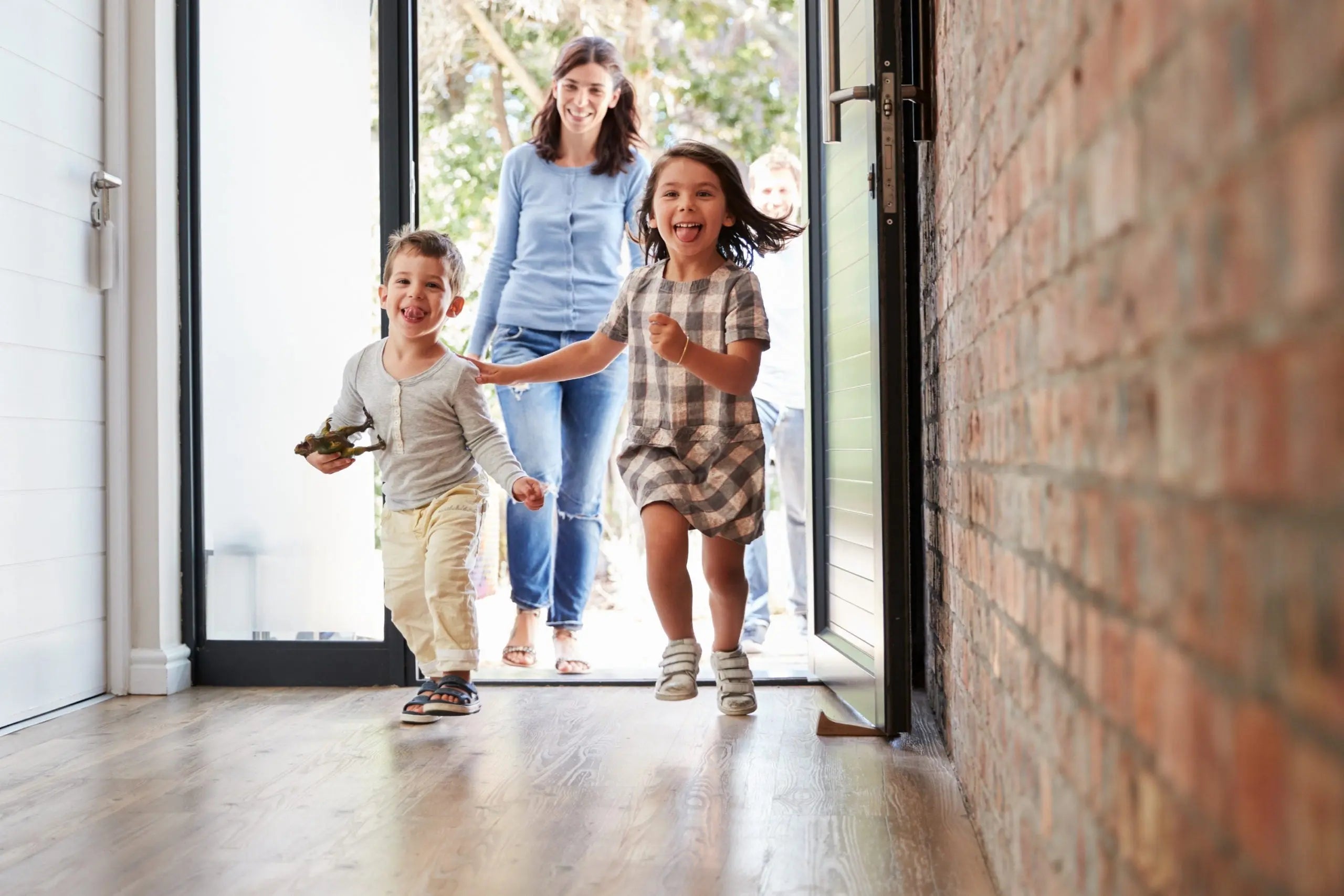 Family organizing school documents and valuables with compact ISLANDSAFE home safe